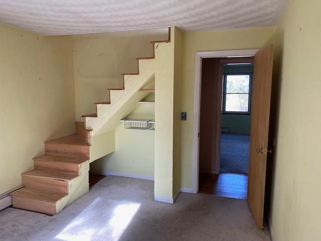 10 Arbor Way Hyannis, MA 02601 - Photo 6 of 17 a view of entryway and hall with wooden floor