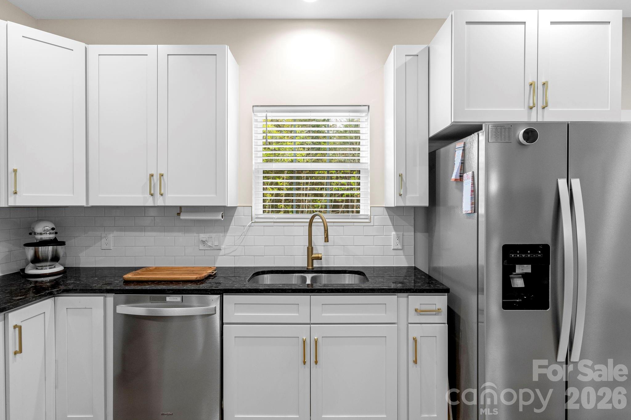 2462 Shoal Road Crouse, NC 28033 - Photo 16 of 35 a kitchen with stainless steel appliances granite countertop a refrigerator and a sink