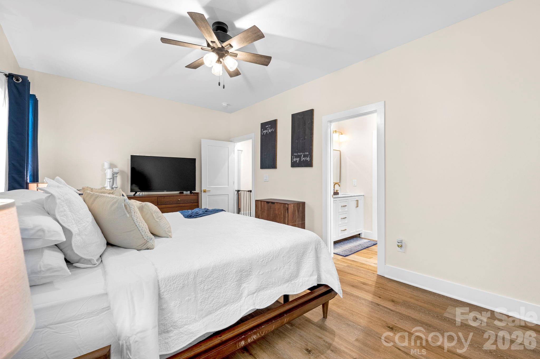 2462 Shoal Road Crouse, NC 28033 - Photo 22 of 35 a bedroom with a bed and a flat screen tv