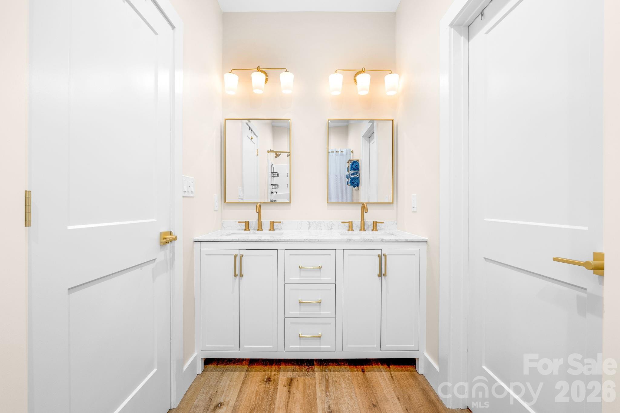 2462 Shoal Road Crouse, NC 28033 - Photo 23 of 35 a bathroom with a sink a mirror and a bathtub