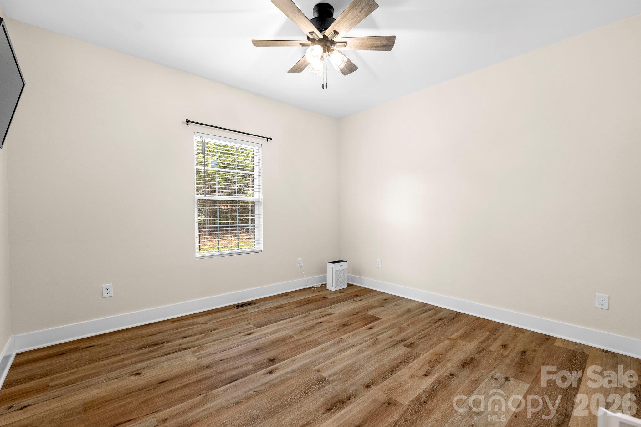 2462 Shoal Road Crouse, NC 28033 - Photo 30 of 35 wooden floor in an empty room with a window