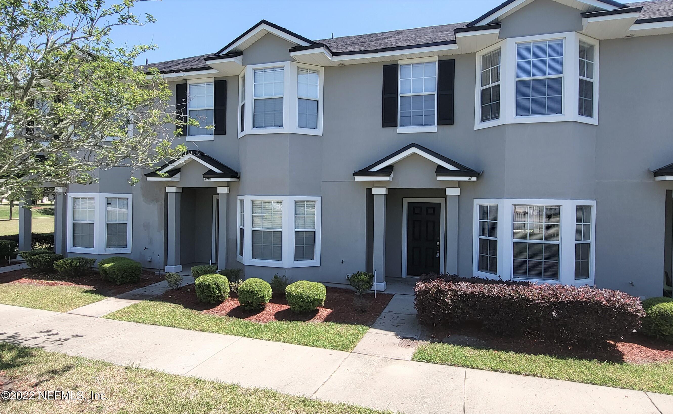 640 Wishing Way Orange Park, FL 32073 - Photo 1 of 10 a front view of a house with a yard