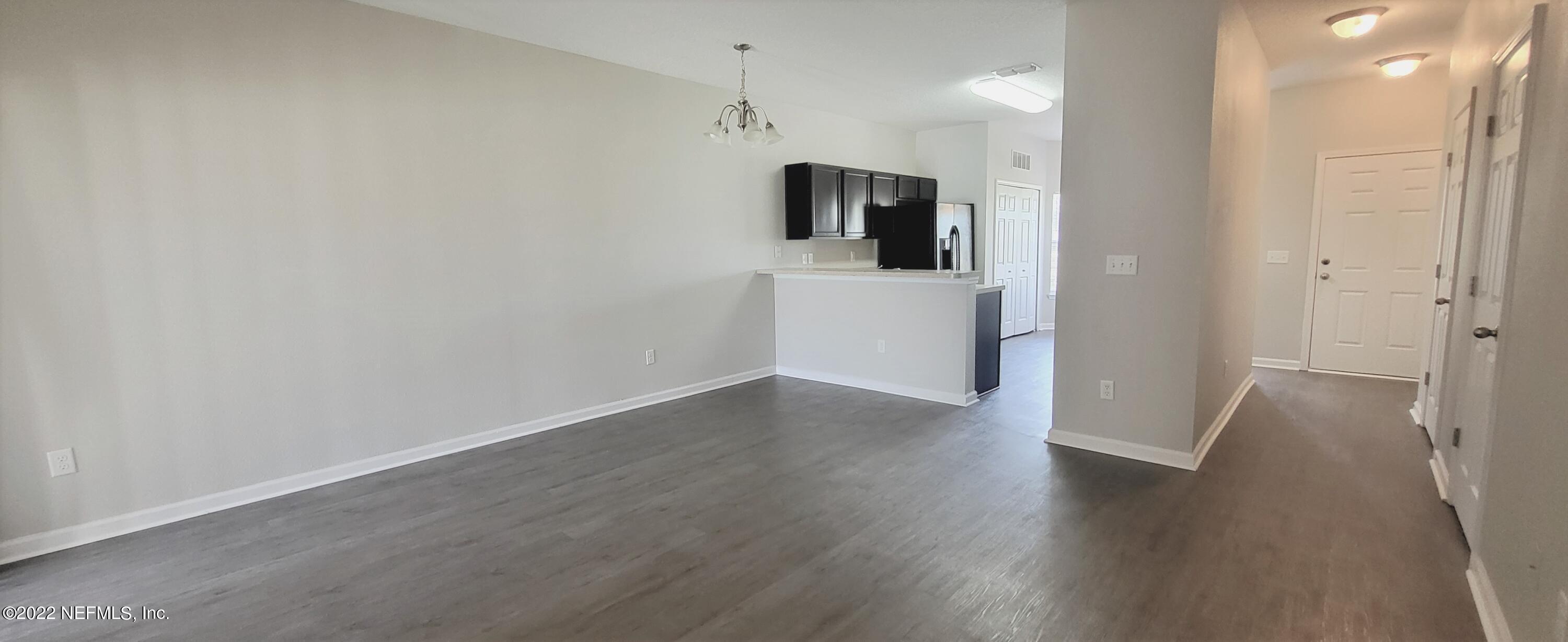 640 Wishing Way Orange Park, FL 32073 - Photo 4 of 10 a view of a kitchen with a sink and a refrigerator