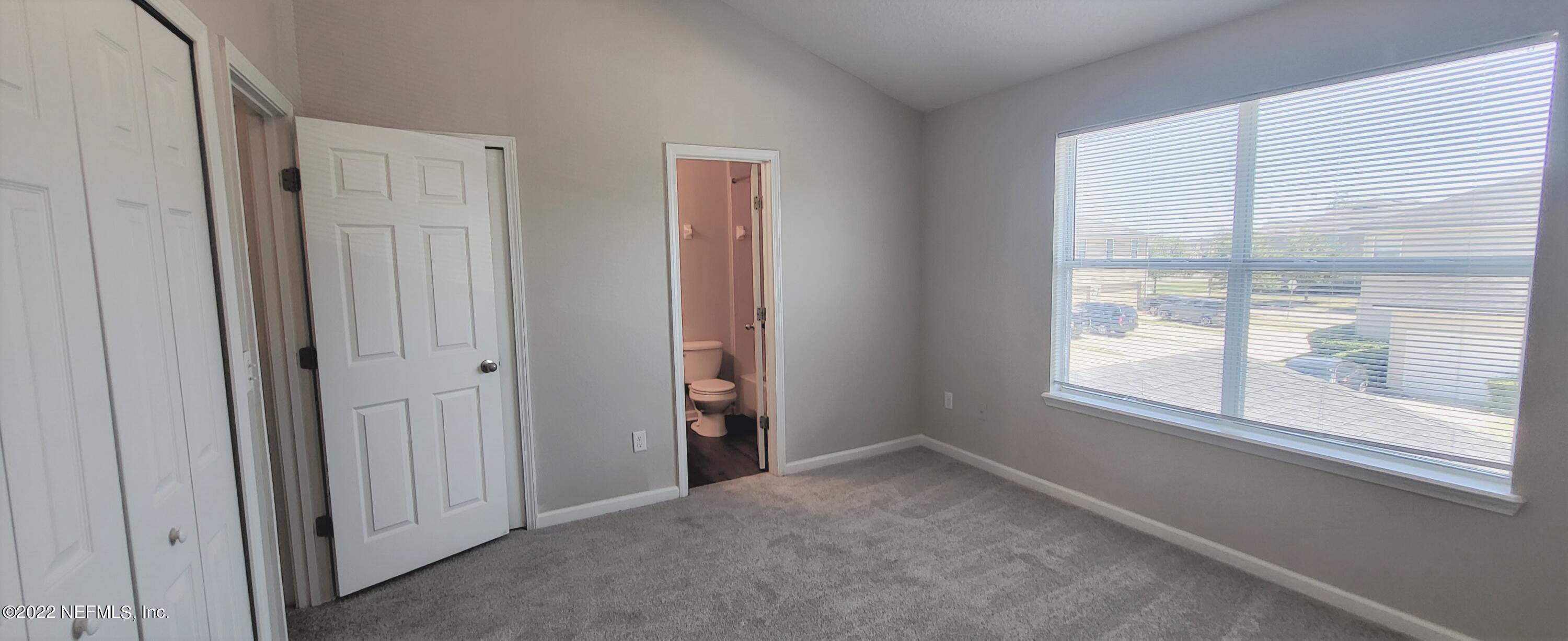 640 Wishing Way Orange Park, FL 32073 - Photo 9 of 10 a view of an empty room with a window