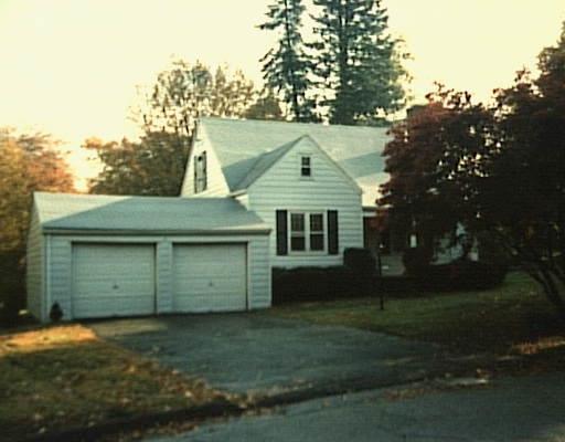720 Frenchtown Road Bridgeport, CT 06606 - Photo 1 of 1 a front view of a house with a garden