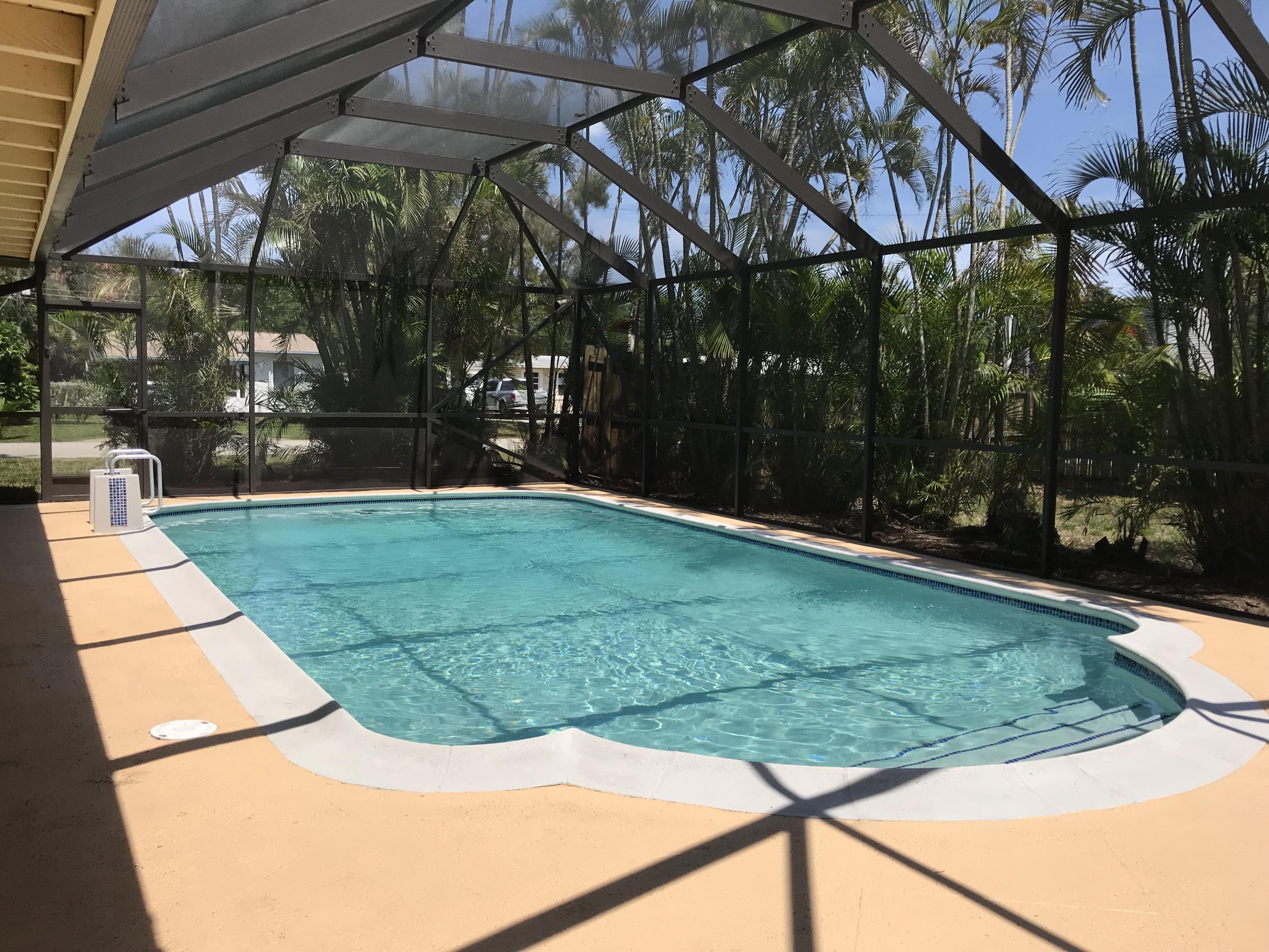 14827 Whatley Road Delray Beach, FL 33445 - Photo 14 of 36 a view of a backyard with sitting area