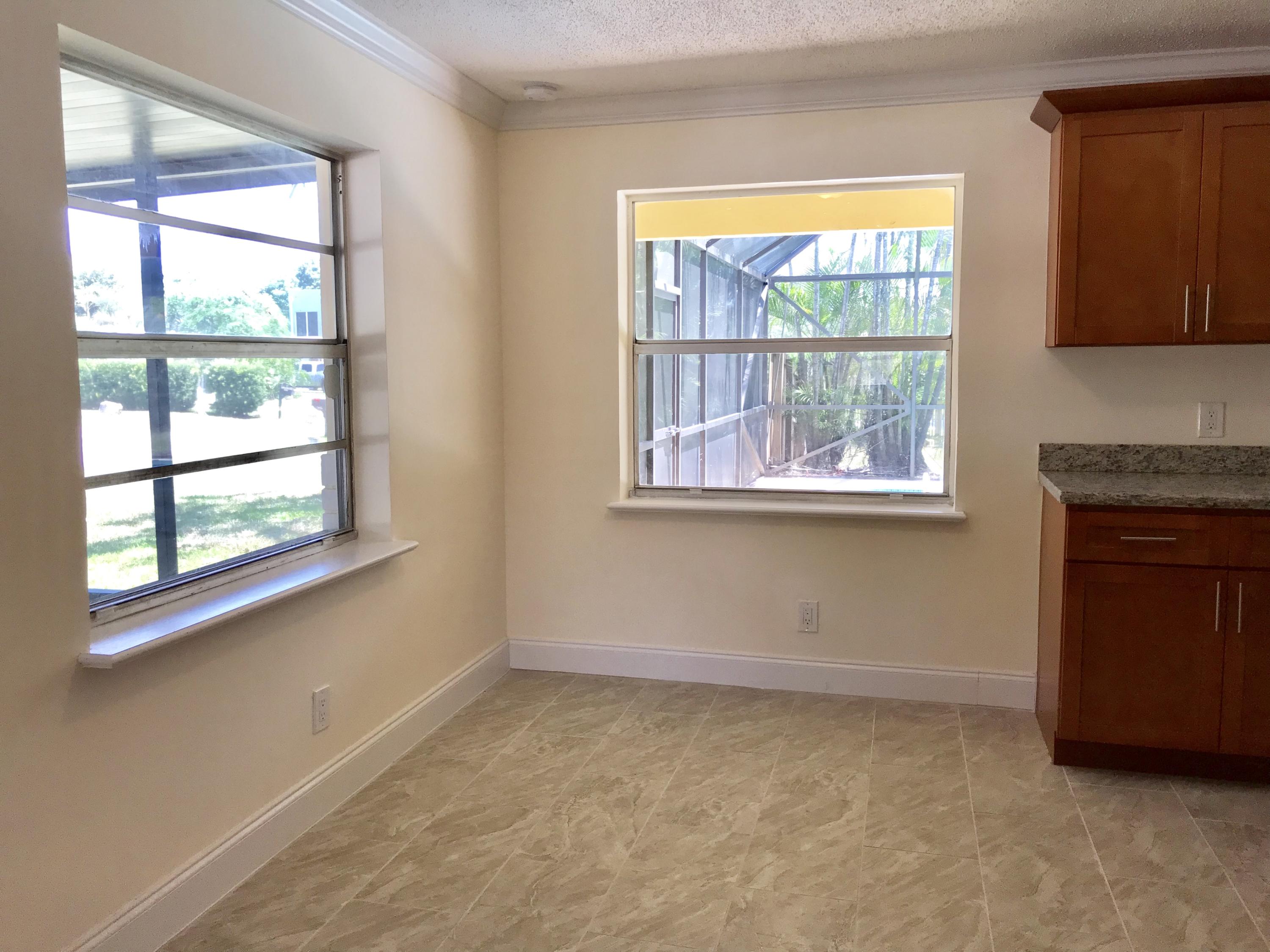 14827 Whatley Road Delray Beach, FL 33445 - Photo 21 of 36 an empty room with a window