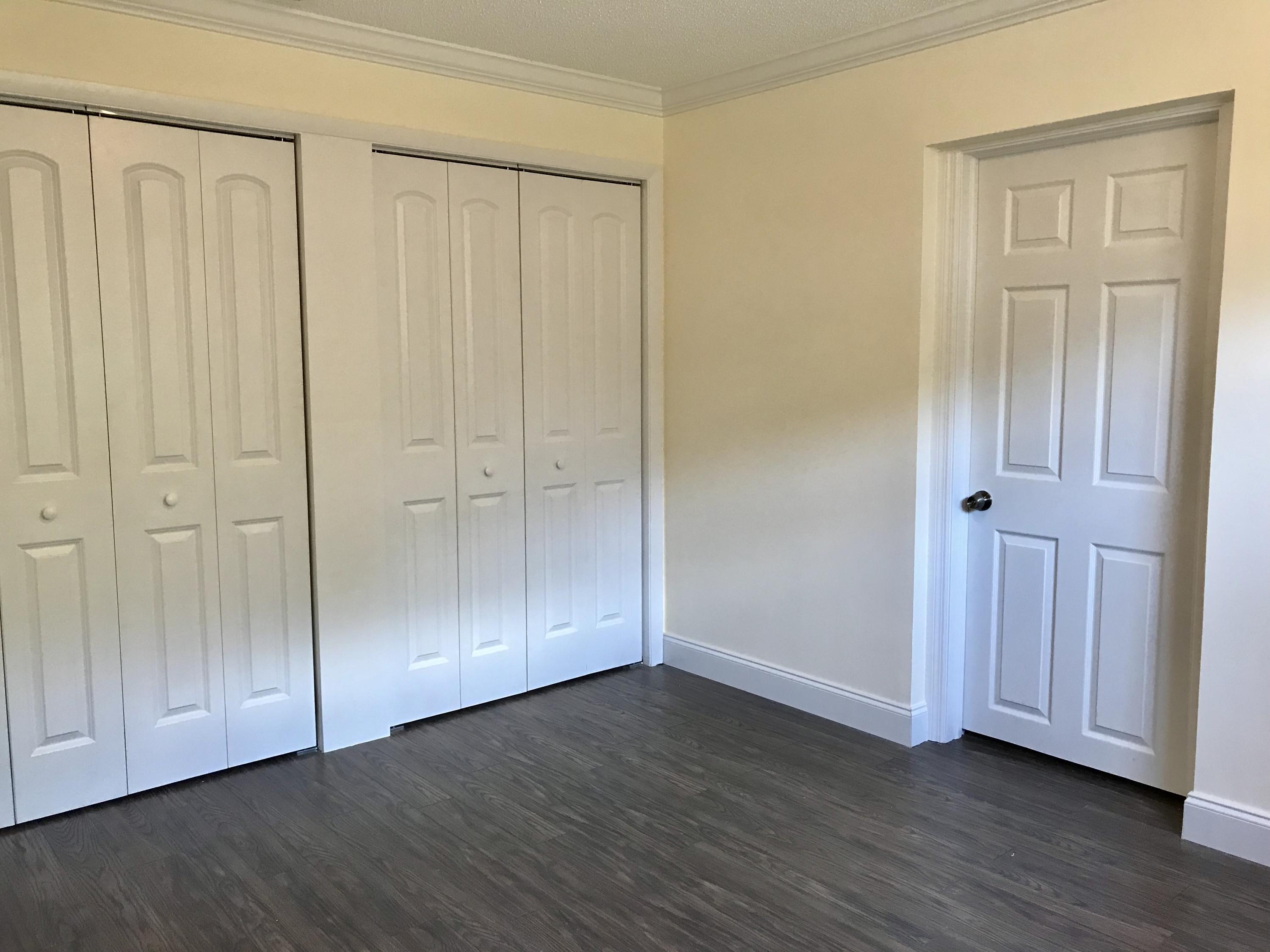 14827 Whatley Road Delray Beach, FL 33445 - Photo 28 of 36 a view of an empty room with wooden floor
