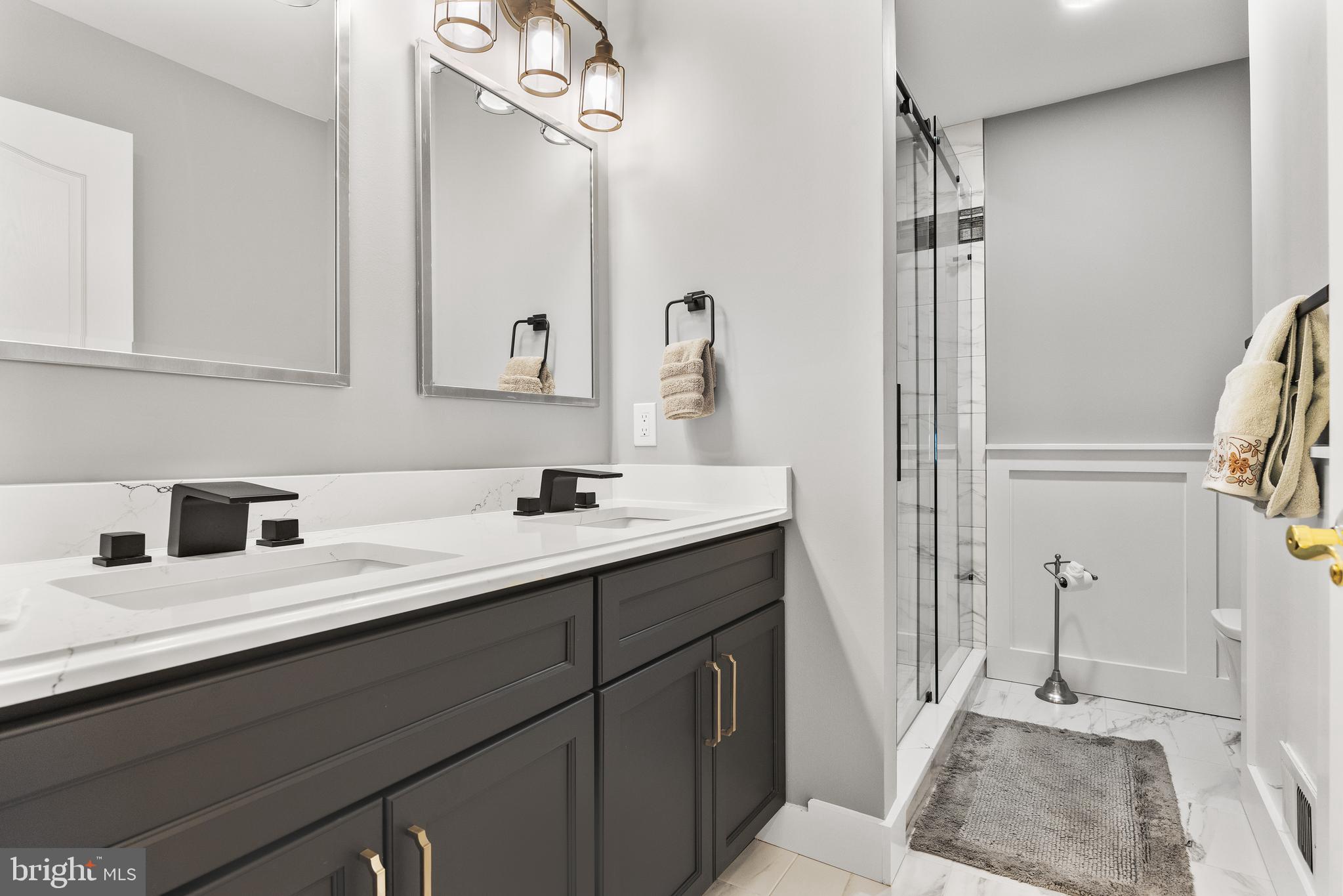 49 Cranberry Lane Delran, NJ 08075 - Photo 27 of 33 a bathroom with a double vanity sink and a mirror