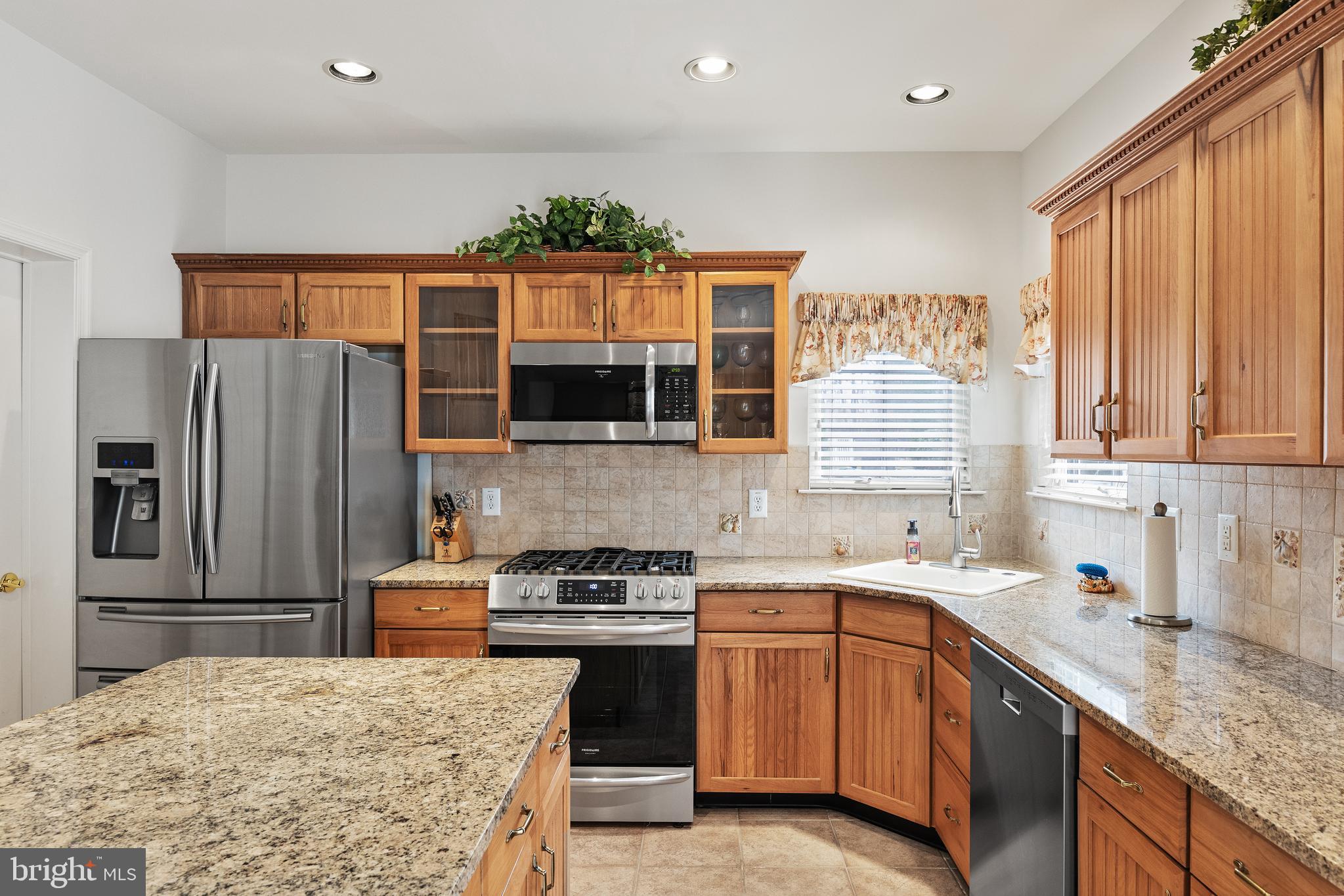 49 Cranberry Lane Delran, NJ 08075 - Photo 4 of 33 a kitchen with stainless steel appliances granite countertop a sink stove microwave and refrigerator