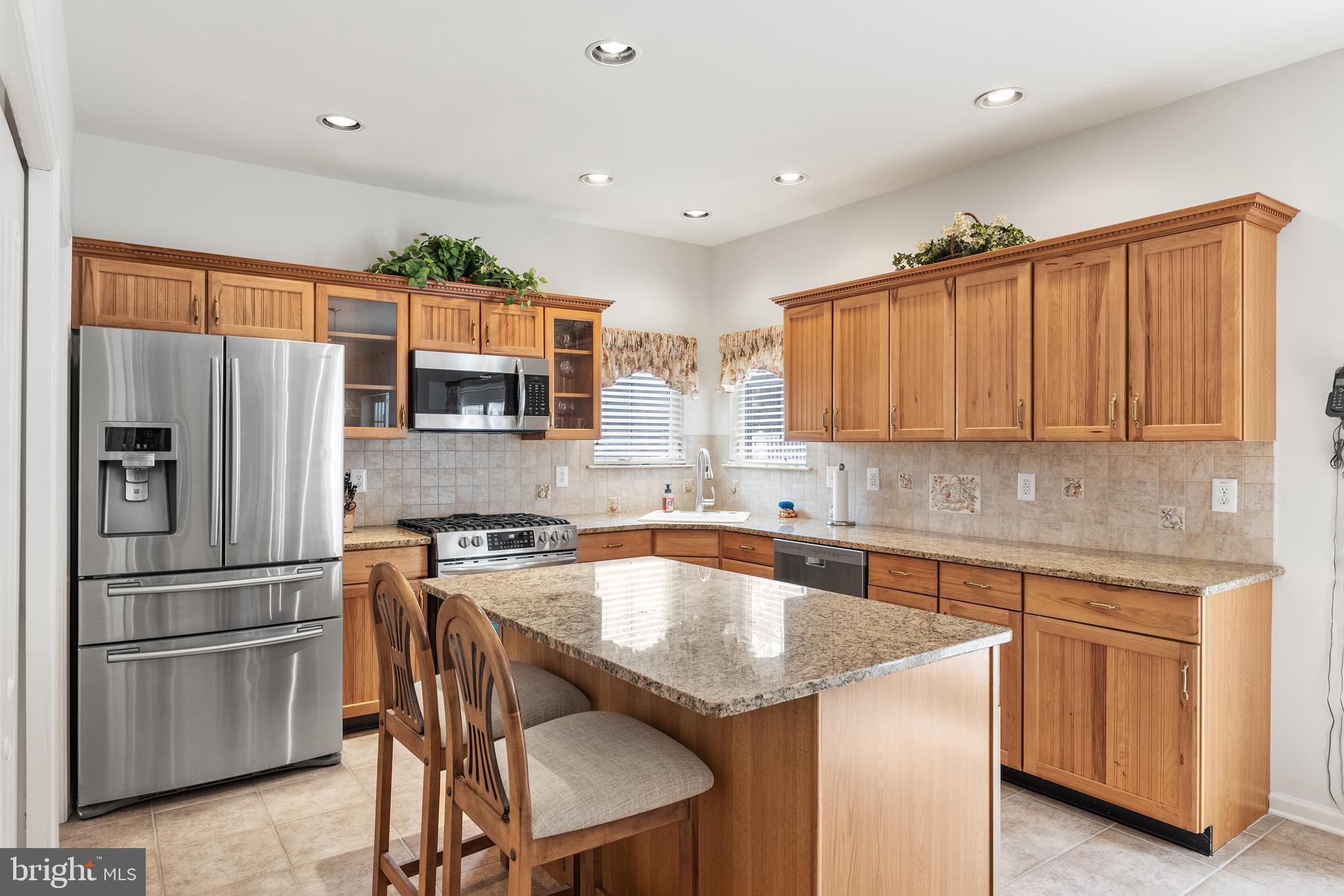 49 Cranberry Lane Delran, NJ 08075 - Photo 5 of 33 a kitchen with stainless steel appliances granite countertop a refrigerator a sink a stove a microwave and island