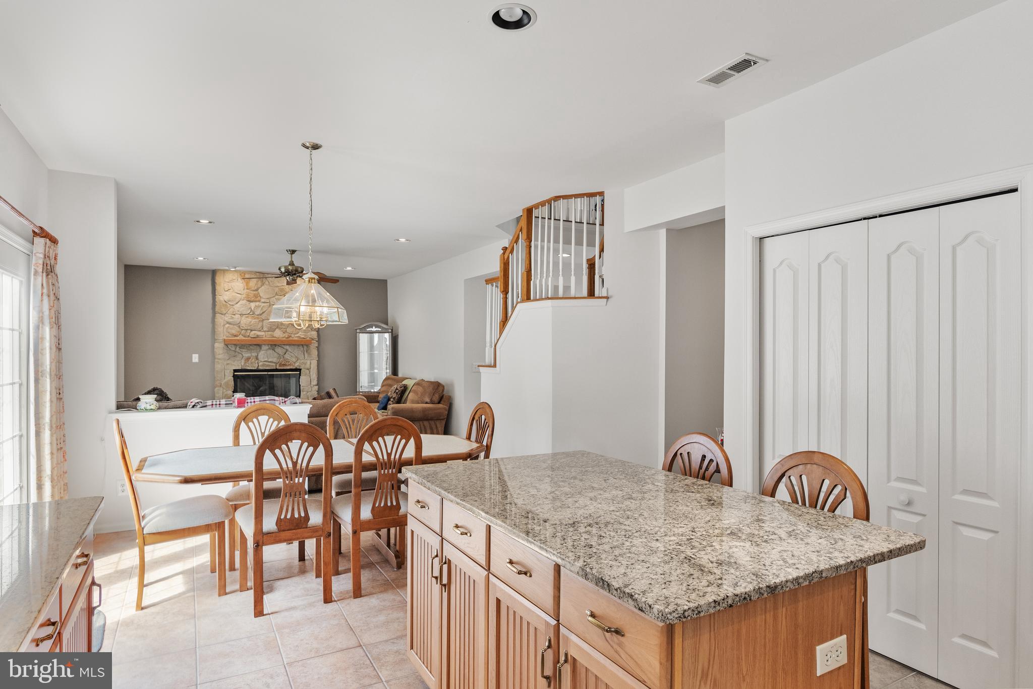 49 Cranberry Lane Delran, NJ 08075 - Photo 7 of 33 a kitchen with a table chairs and white cabinets