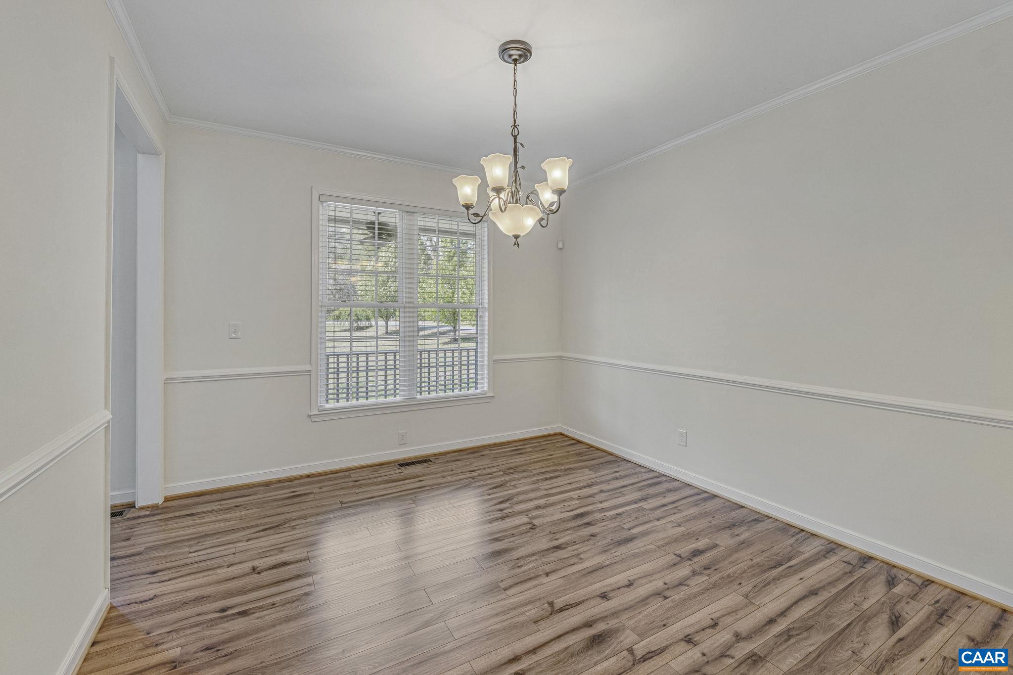 1130 Race Ground Road Rochelle, VA 22738 - Photo 15 of 58 a view of a room with wooden floor chandelier and a window