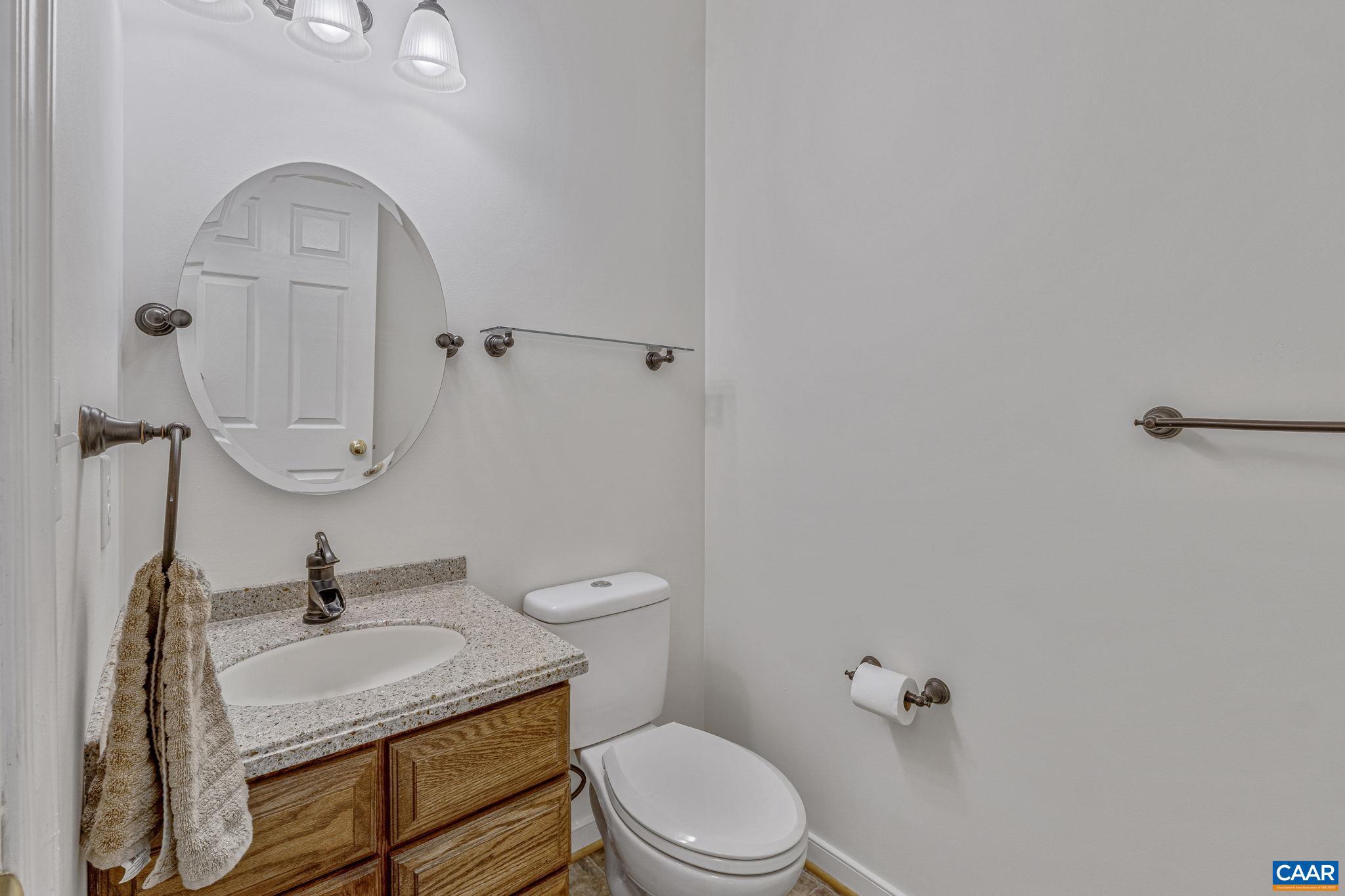 1130 Race Ground Road Rochelle, VA 22738 - Photo 23 of 58 a bathroom with a sink toilet a mirror and vanity