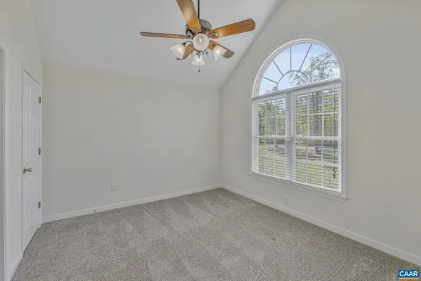 a view of a balcony with furniture and wooden floor