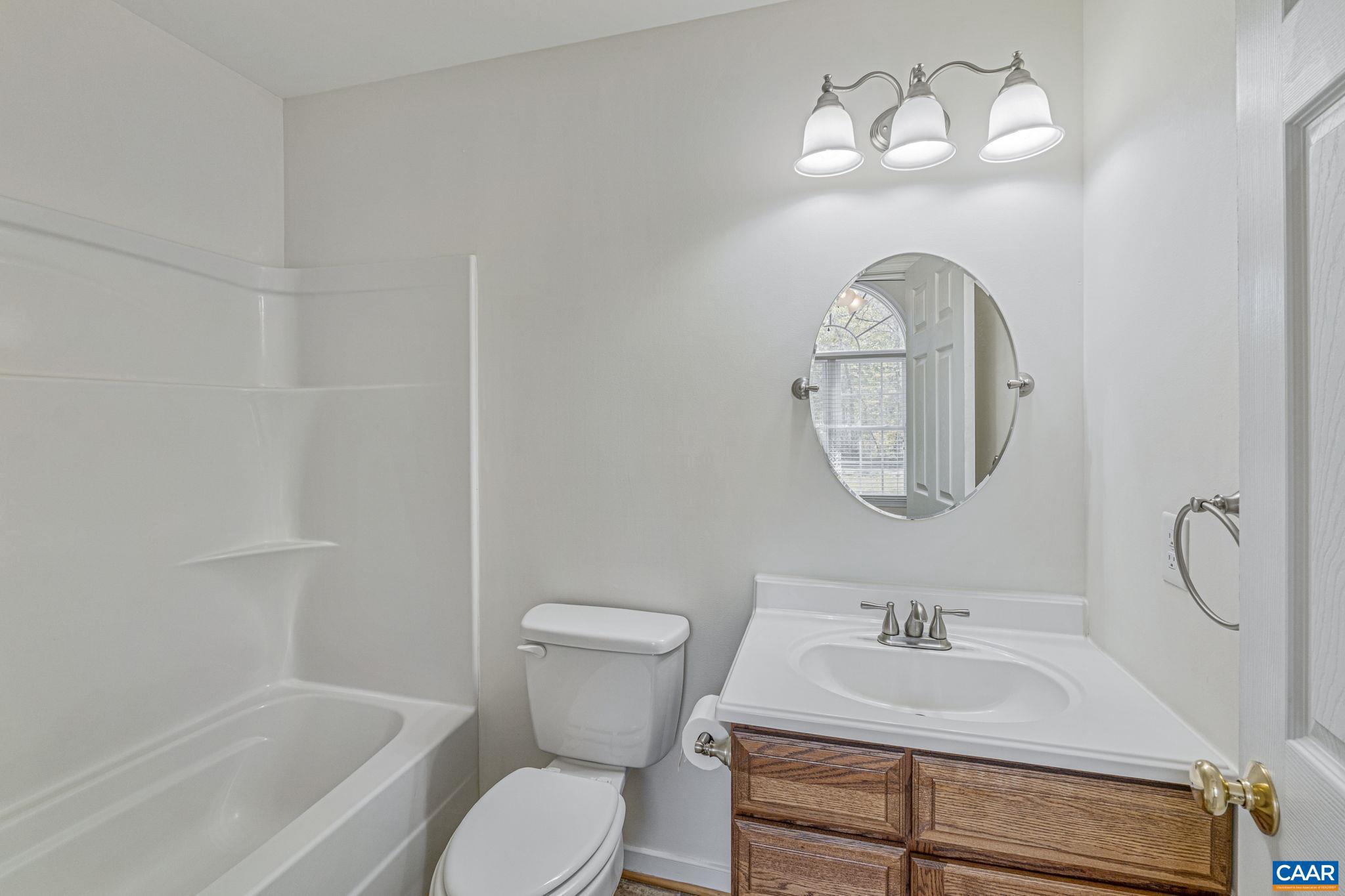 1130 Race Ground Road Rochelle, VA 22738 - Photo 40 of 58 a bathroom with a toilet sink and mirror