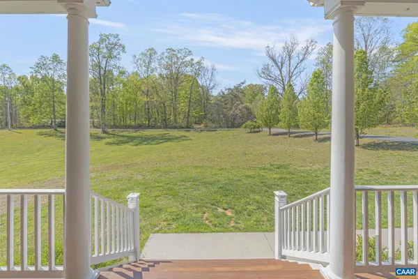 a view of a lake with a house in the background