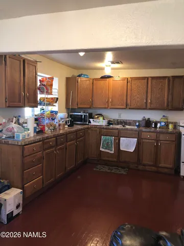 a view of living room with furniture and a flat screen tv