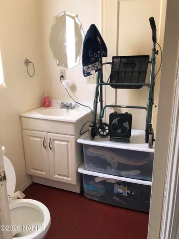 a living room with furniture and flat screen tv