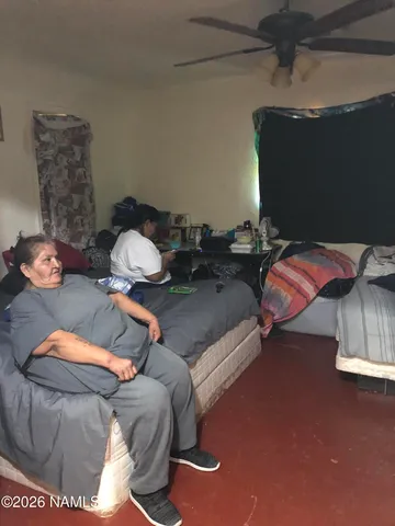 a bed sitting in a bedroom next to a bathroom