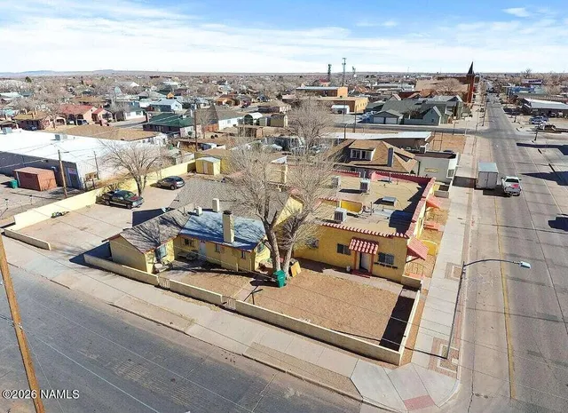 an aerial view of residential houses with outdoor space