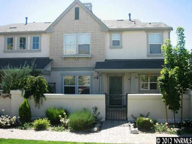 1606 Spring Hill Drive Reno, NV 89523 - Photo 1 of 1 a front view of a house with a yard and garage