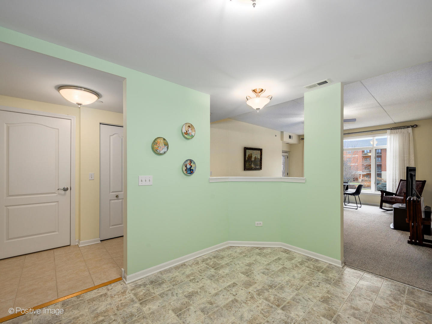 855 East 22nd Street, Unit 217 Lombard, IL 60148 - Photo 11 of 27 a view of livingroom with furniture and a ceiling fan