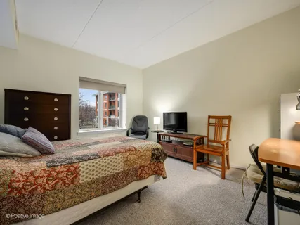 a bedroom with a bed and furniture