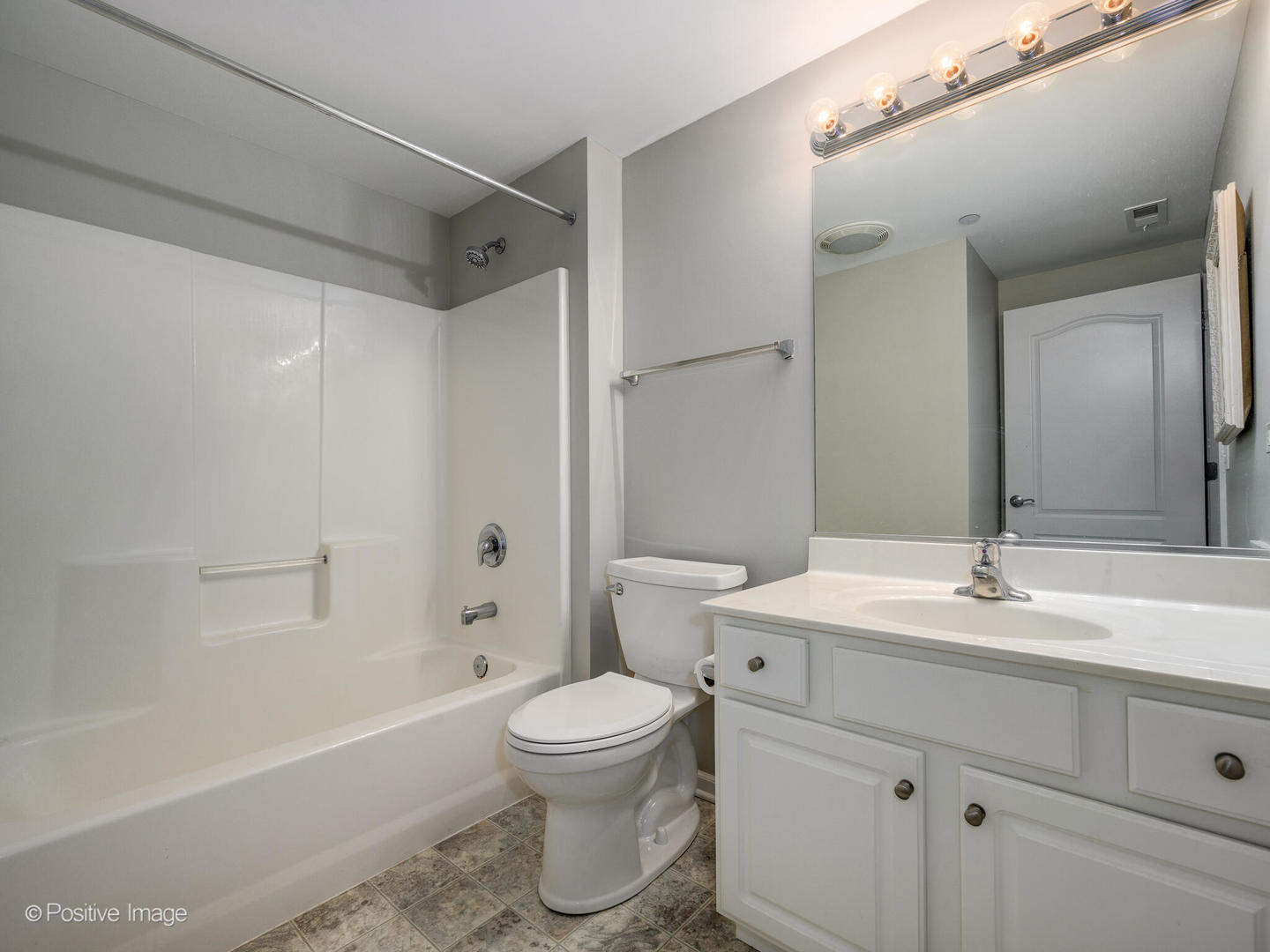 855 East 22nd Street, Unit 217 Lombard, IL 60148 - Photo 15 of 27 a bathroom with a sink toilet vanity and shower