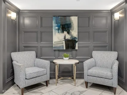 a living room with furniture a window and a table