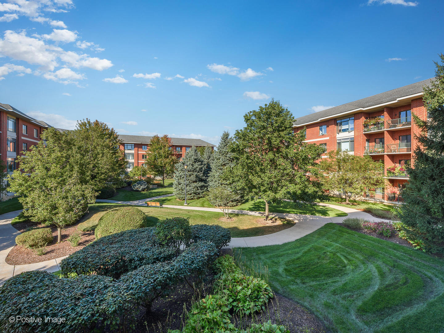 855 East 22nd Street, Unit 217 Lombard, IL 60148 - Photo 24 of 27 a view of a swimming pool with a yard and plants