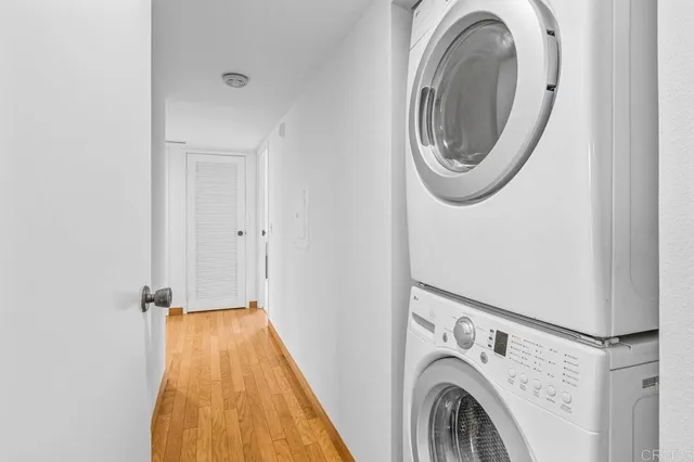 a view of a storage & utility room with dryer and washer