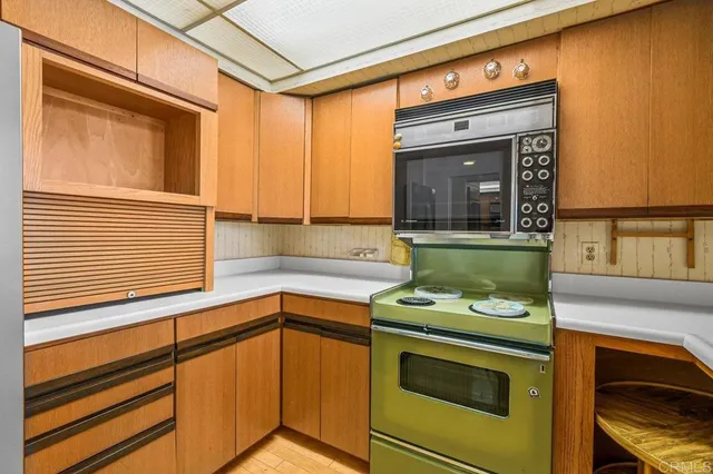 a kitchen with a stove and a microwave