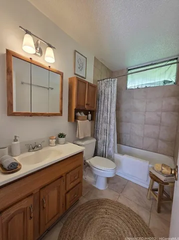 a bathroom with a sink toilet a mirror and shower