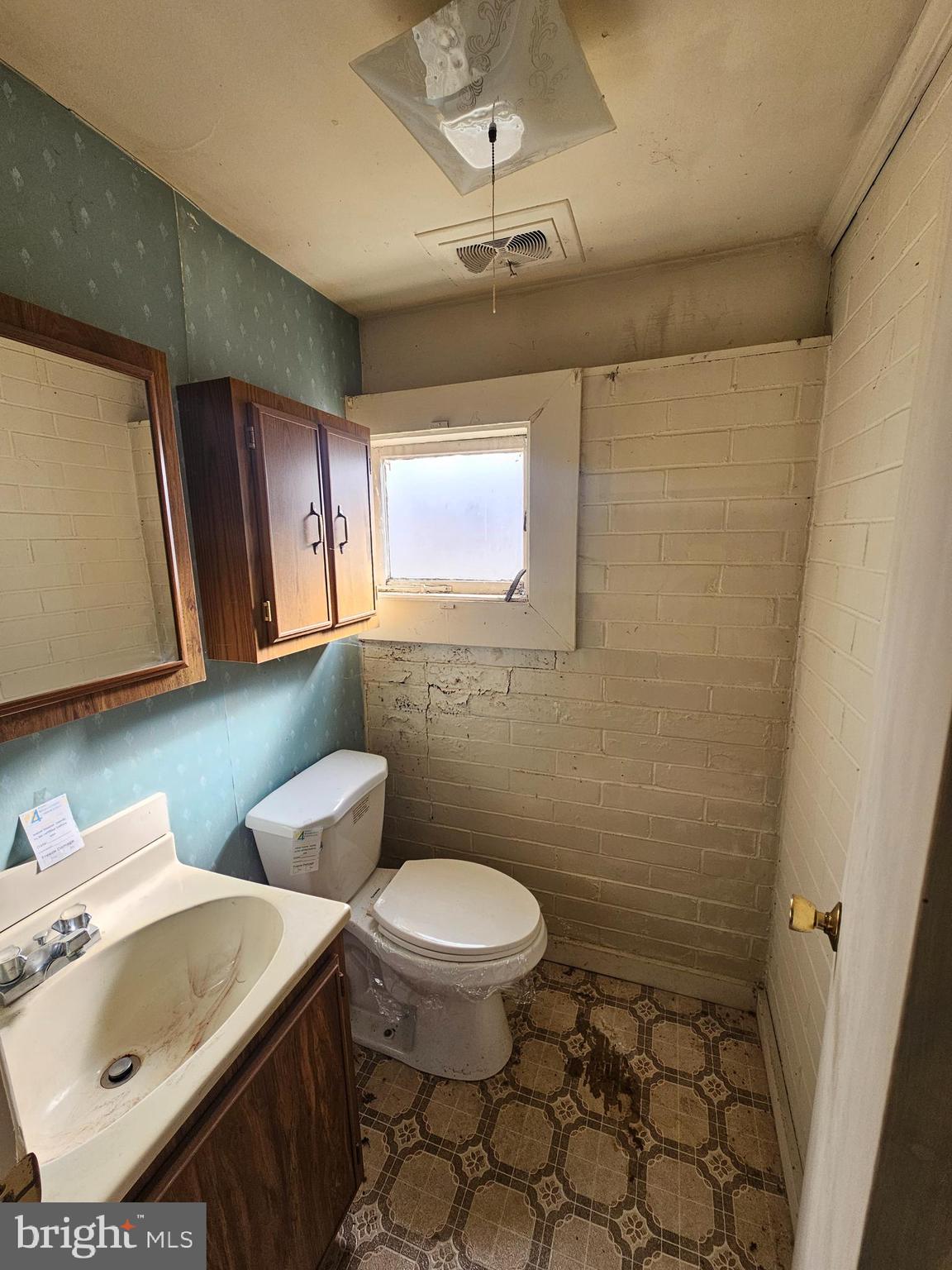 407 East Elm Street Lebanon, PA 17042 - Photo 11 of 16 a bathroom with a sink a toilet and mirror