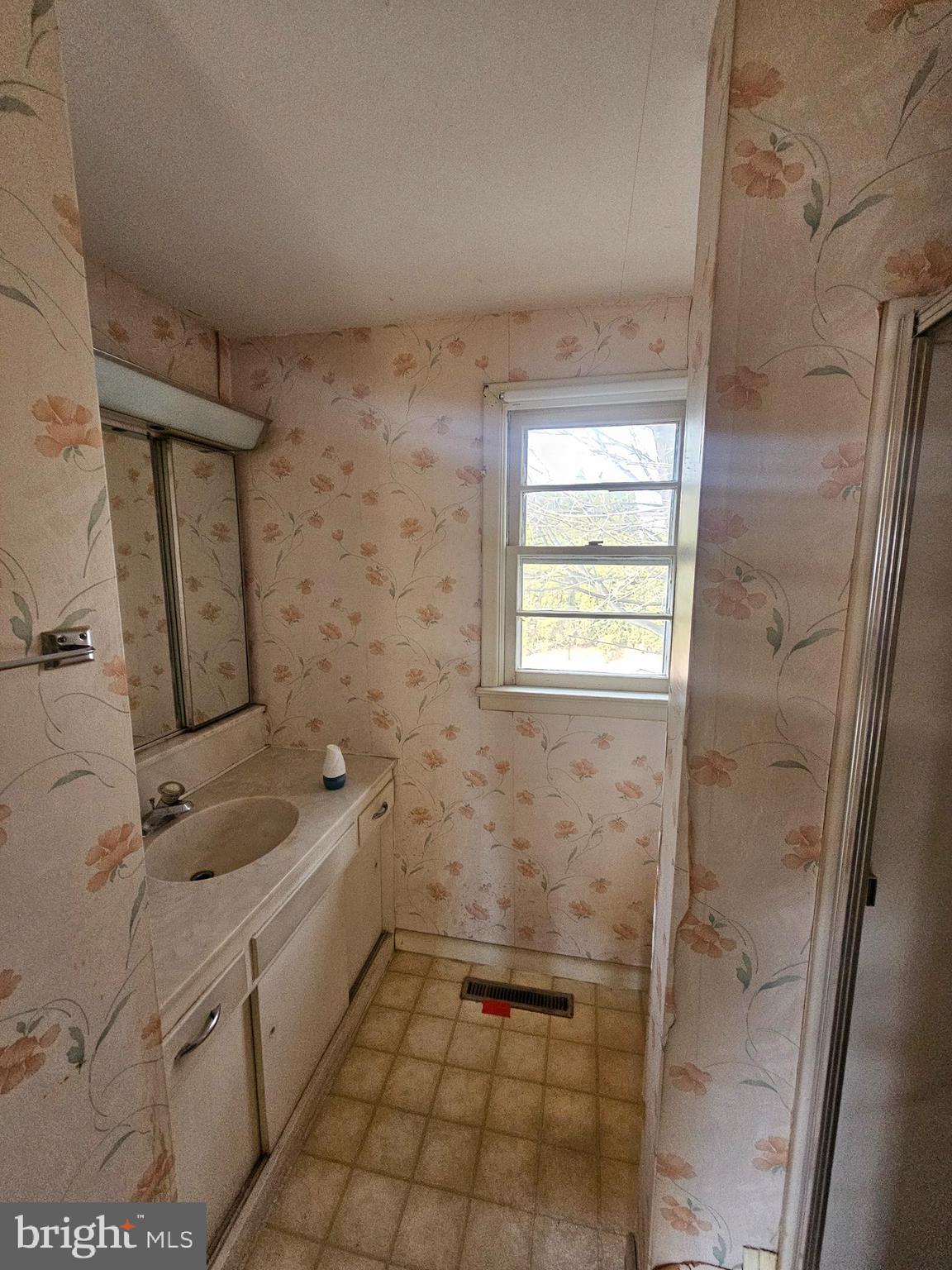 407 East Elm Street Lebanon, PA 17042 - Photo 12 of 16 a bathroom with a granite countertop sink toilet and shower