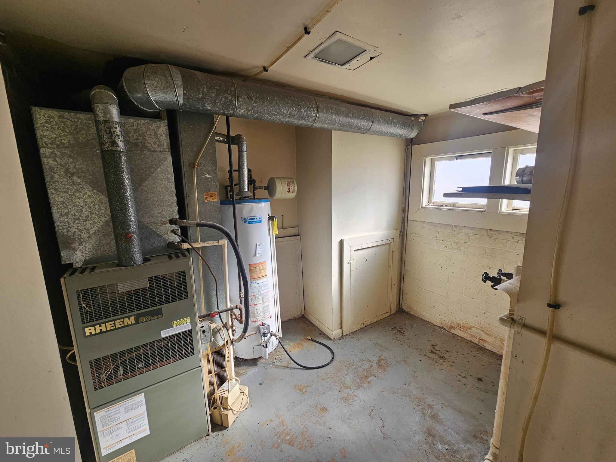 407 East Elm Street Lebanon, PA 17042 - Photo 13 of 16 a view of water heater room with wooden floor