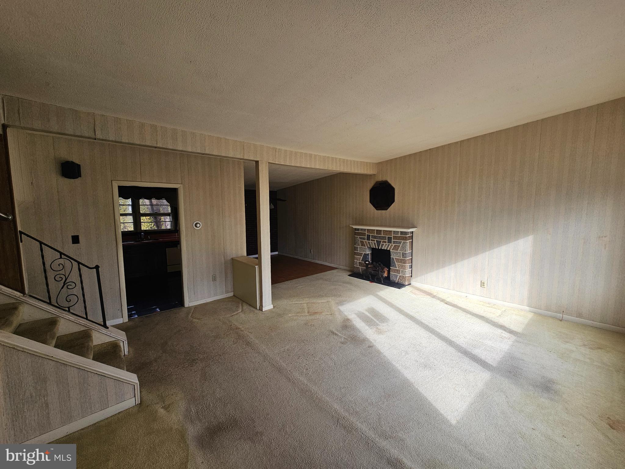 407 East Elm Street Lebanon, PA 17042 - Photo 4 of 16 a view of a livingroom with wooden floor and staircase