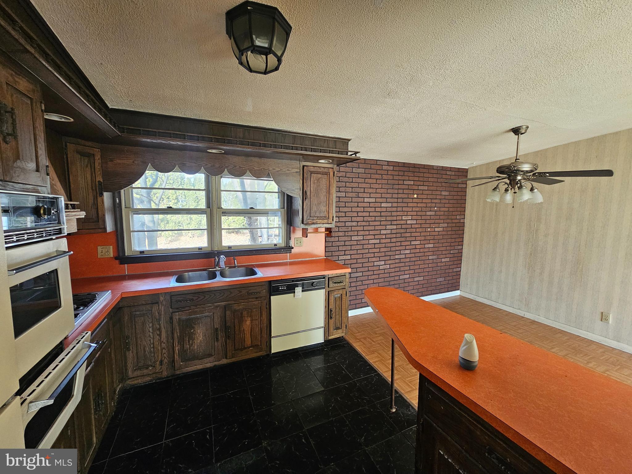407 East Elm Street Lebanon, PA 17042 - Photo 5 of 16 a kitchen with stainless steel appliances granite countertop a sink and stove top oven