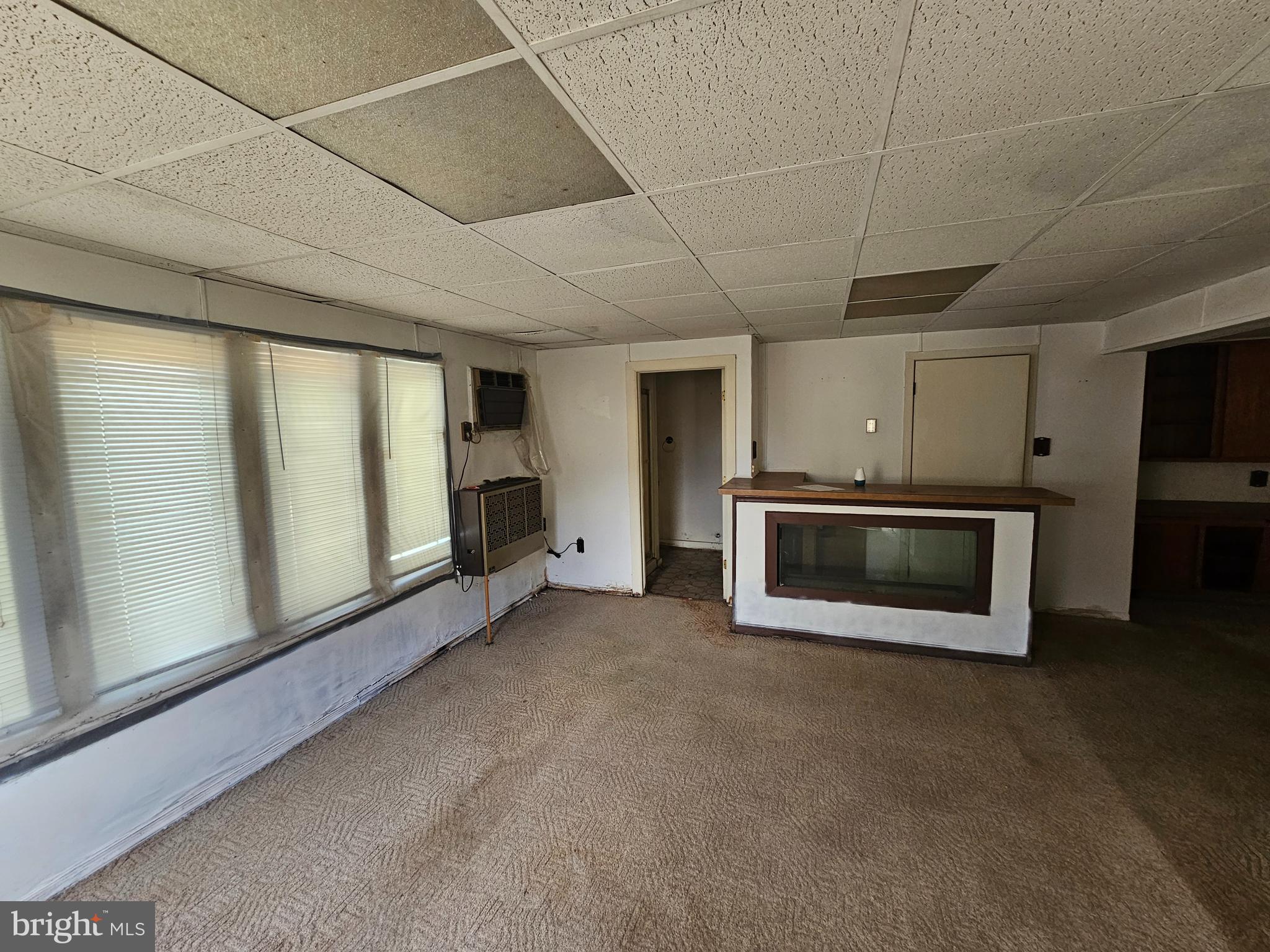 407 East Elm Street Lebanon, PA 17042 - Photo 10 of 16 a view of an empty room with a fireplace and a window