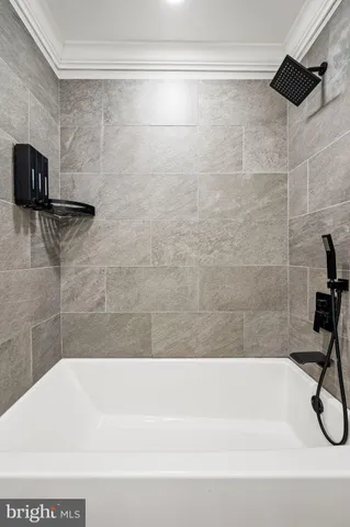 a bathroom with a shower and a shower