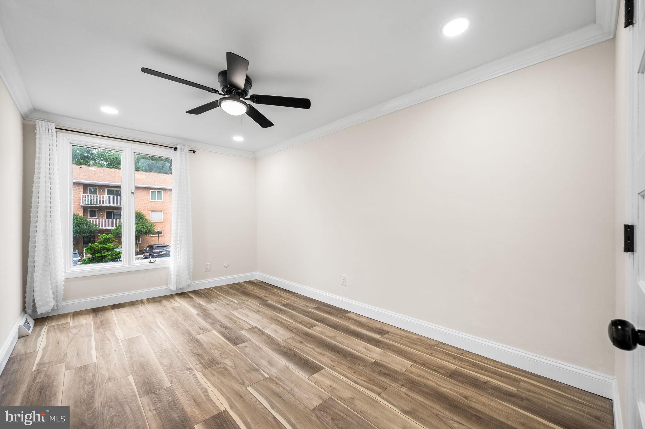 43 Gunning Lane, Unit 12 Downingtown, PA 19335 - Photo 17 of 19 wooden floor in an empty room with a window
