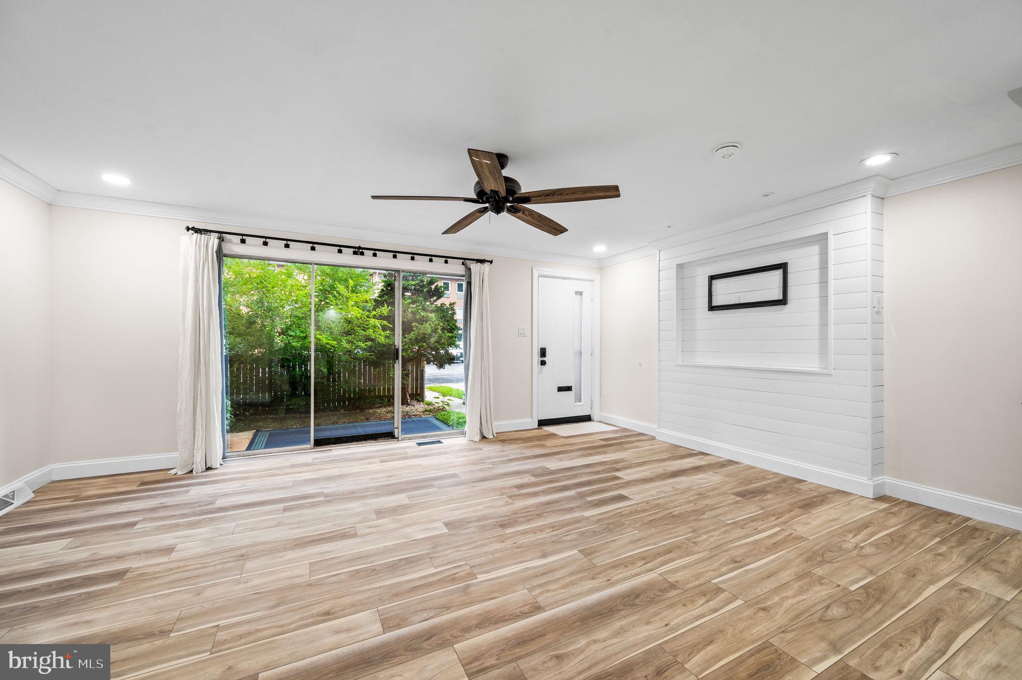 43 Gunning Lane, Unit 12 Downingtown, PA 19335 - Photo 4 of 19 a view of a livingroom with a ceiling fan and window