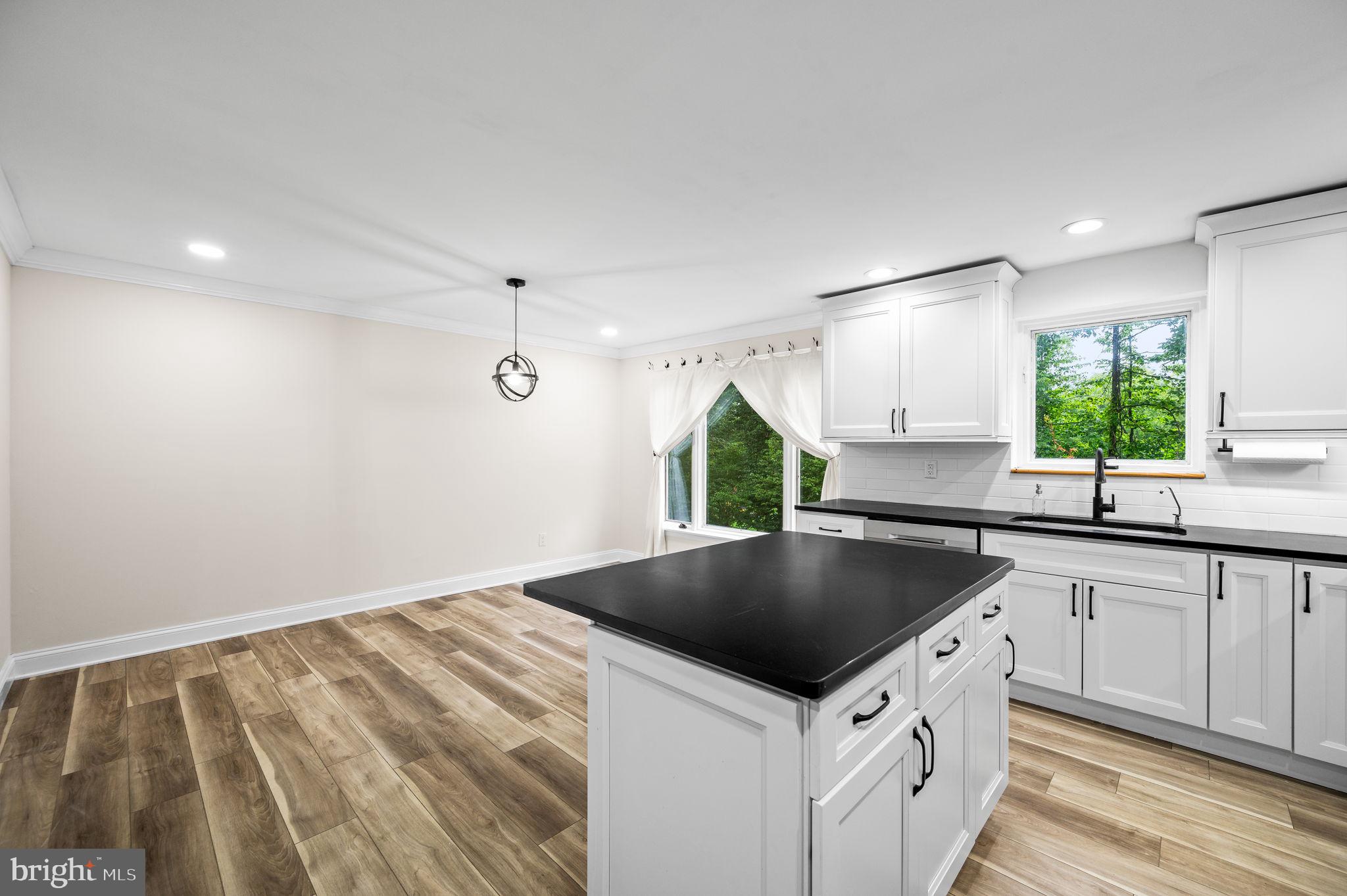 43 Gunning Lane, Unit 12 Downingtown, PA 19335 - Photo 7 of 19 a kitchen that has a sink and a stove in it