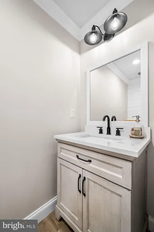 a bathroom with a sink and mirror