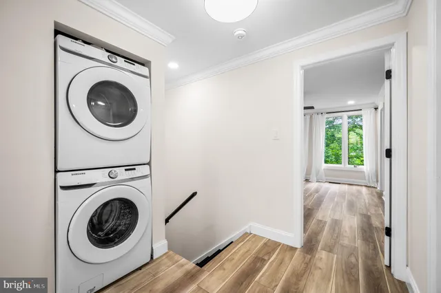 a view of a hallway with washer and dryer