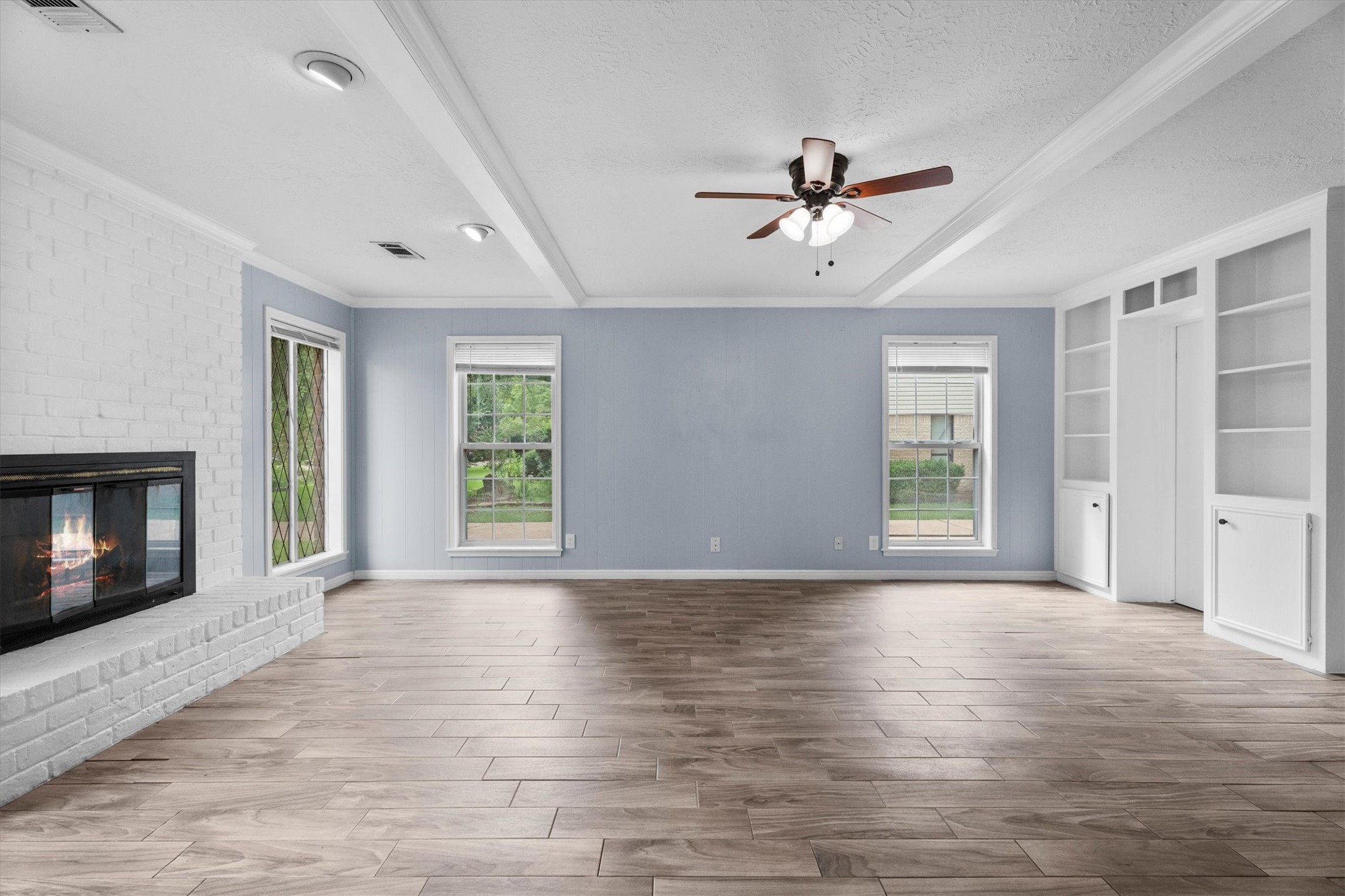 17319 Cypress Spring Drive Spring, TX 77388 - Photo 7 of 50 Two additional floor to ceiling windows bring in additional natural sunlight. With a space this big, furniture options are plentiful.