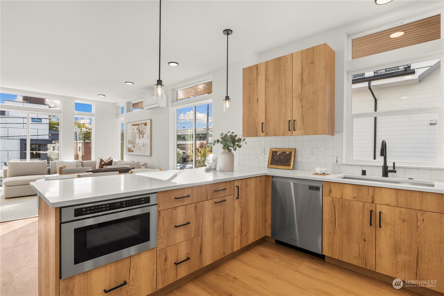508 North 48th Street Seattle, WA 98103 - Photo 13 of 38 a kitchen with a sink stove and cabinets