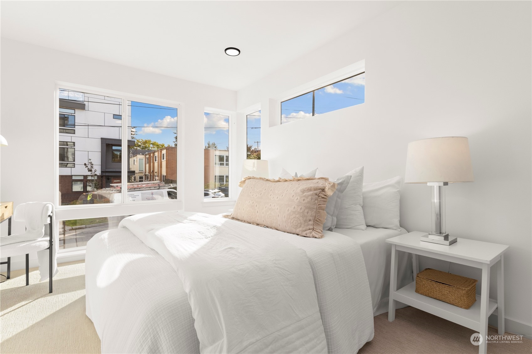 508 North 48th Street Seattle, WA 98103 - Photo 20 of 38 a large white bed in a white room