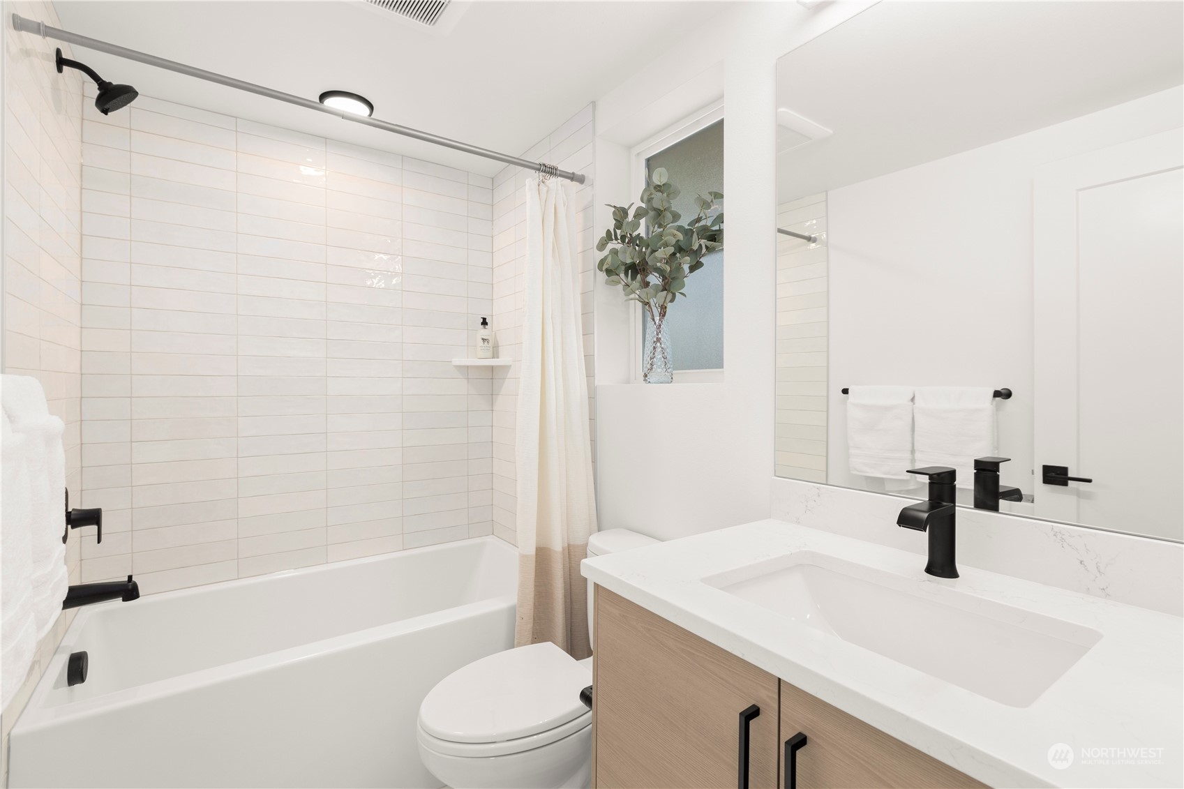 508 North 48th Street Seattle, WA 98103 - Photo 22 of 38 a bathroom with a sink a toilet and a bathtub